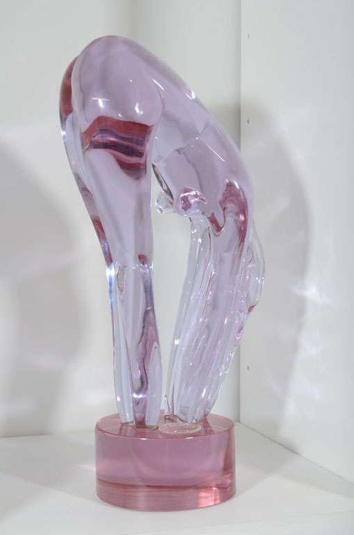 Lavender Murano glass of a bending nude woman. Artist signed on base.