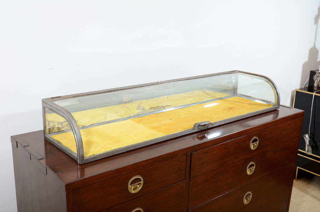 A Long Steel, Mirrored and Glass Display Case.
