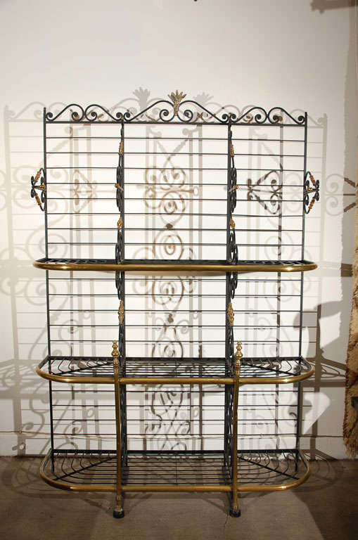 19th Century French wrought iron and brass baker's rack on casters with solid brass fittings and crowned with a wheat sheaf motif. Elegant, sturdy and strong
PARIS 1900 Original with Manufacture signature on Iron.
Stylish original belle epoque