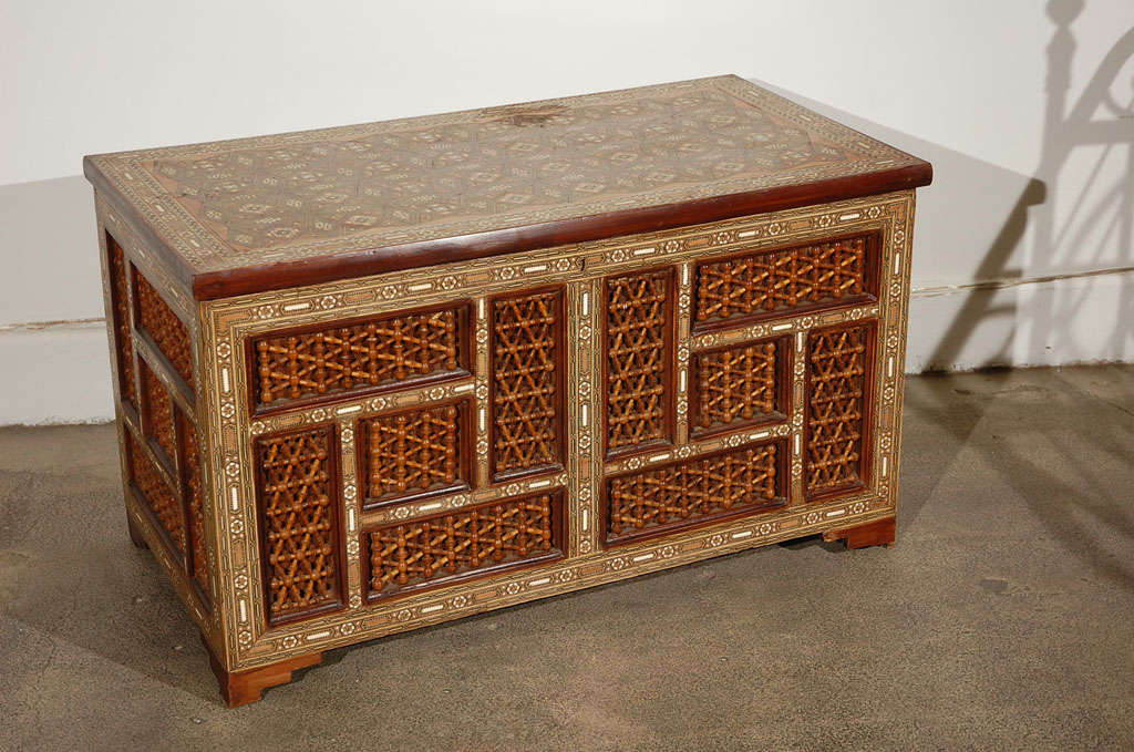 Moorish Style inlaid trunk, various fuitwood marquetery and mother of pearl inlay and mousharabie, probably Syria or Egypt.

Mosaik provides Antiques,Art Deco, Moorish Style, Spanish, African, Islamic Art, Arabian, Middle Eastern, Egyptian, Syrian