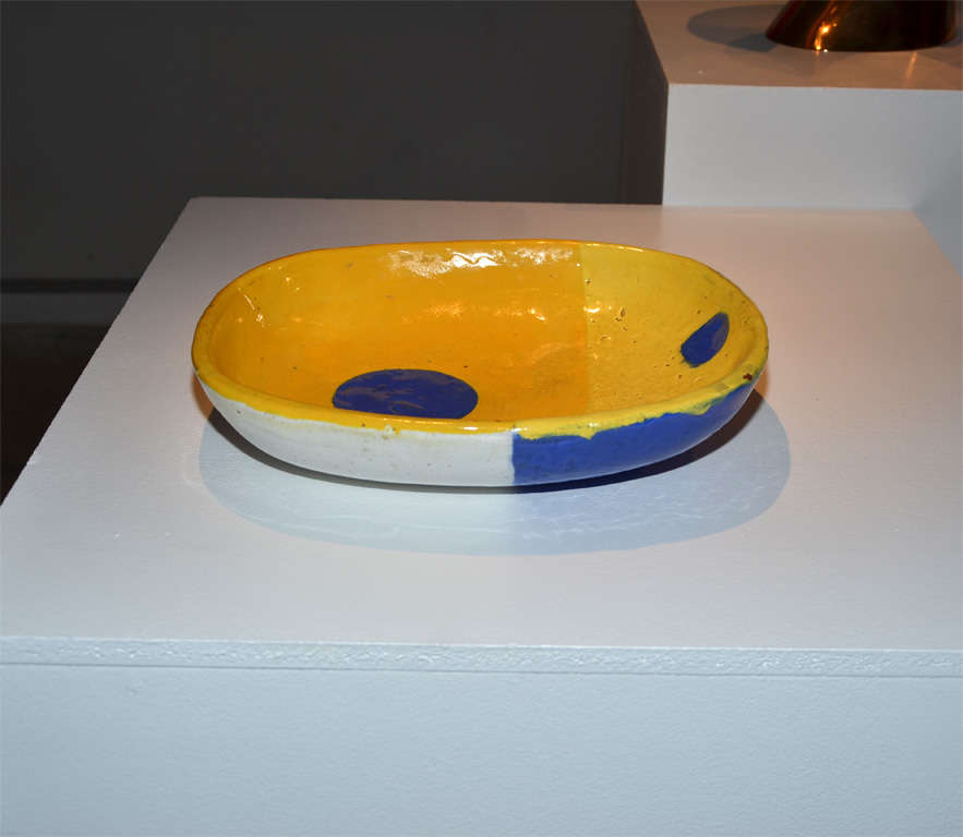 Huge ceramic bowl dated 1957 with a yellow background and two blue dots; exterior is blue and white; signed Jean Mégard - Biot.

About the Artist :

As a ceramist Jean Megard (1925 - 2015) took part in the early fifties to several exhibitions of two