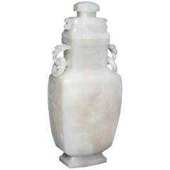 A Chinese Carved White Jade Covered Vase