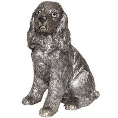 A rare Seated Silver Haired Spaniel Dog Statue by M. Buccellati