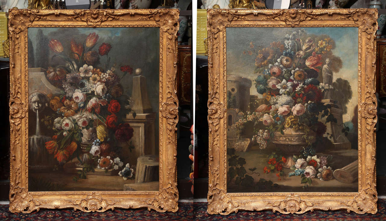 A fine pair of oil on canvas still life paintings of flowers, antique French, 18th century with original hand-carved giltwood frames. This pair is an excellent example of the French trend of emulating the Flemish still life tradition from the Dutch
