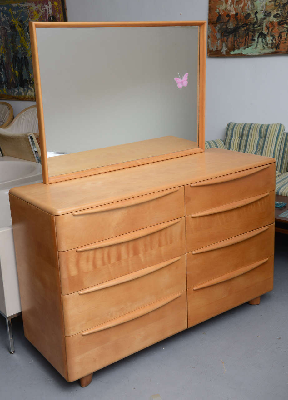 Beautifully restored Maple Double Dresser (8 drawers) from the Encore Bedroom Group by Heywood Wakefield.  Dresser comes with a detachable mirror that has a small crack (where the butterfly is to mark the crack.  This would have to be replaced,