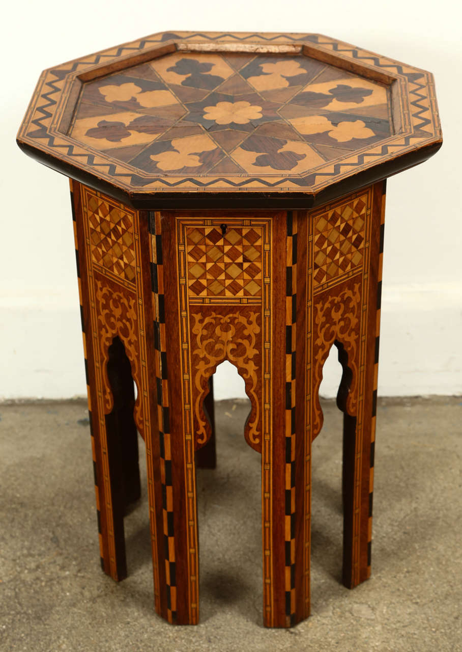 Levantine Moorish Style Side table.
Very nice, elegant rosewood marquetry hexagonal occasional side table with Moorish arches. Beautifully patterned intricate inlay of different kind of precious fruit wood.
The top of the table open for a hidden