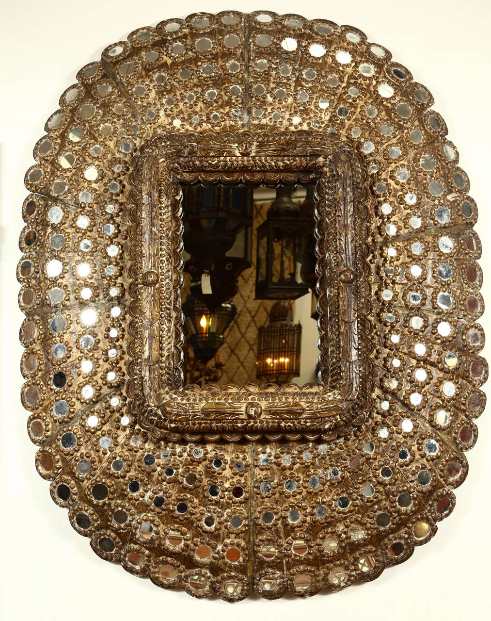 Impressive exotic Hispano Moresque large scale hand-carved gilt wood inset with a multitude of small mirrors.
Could be hang both ways.