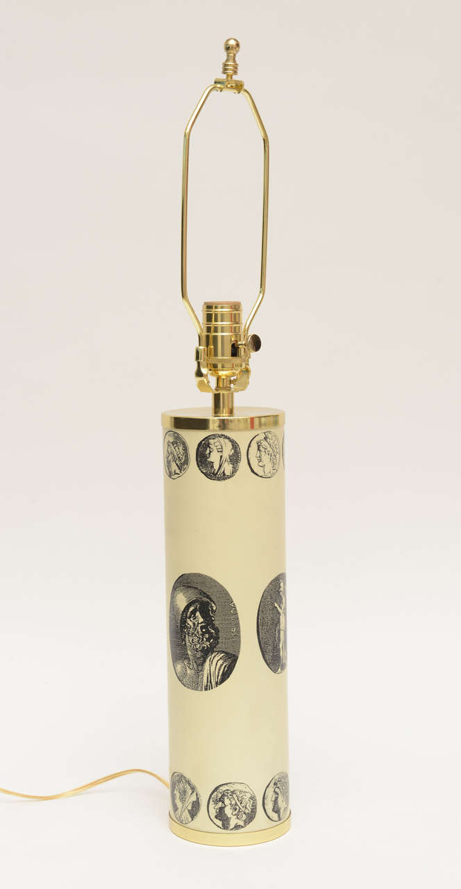 The Roman appearances of historical leaders make up this special vintage Italian cameo Mid-Century Modern lamp by Piero Fornasetti. It is enameled metal and new polished brass fittings. The original bottom brass and top brass has been polished. All