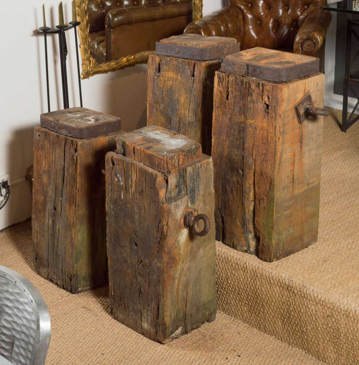 Set of four wooden fragments from France circa the early 1900s. Fragments have iron handles on the sides and raised tops. These wooden sculptures could be used creatively but make great decorative objects. Each fragment varies in size but measure