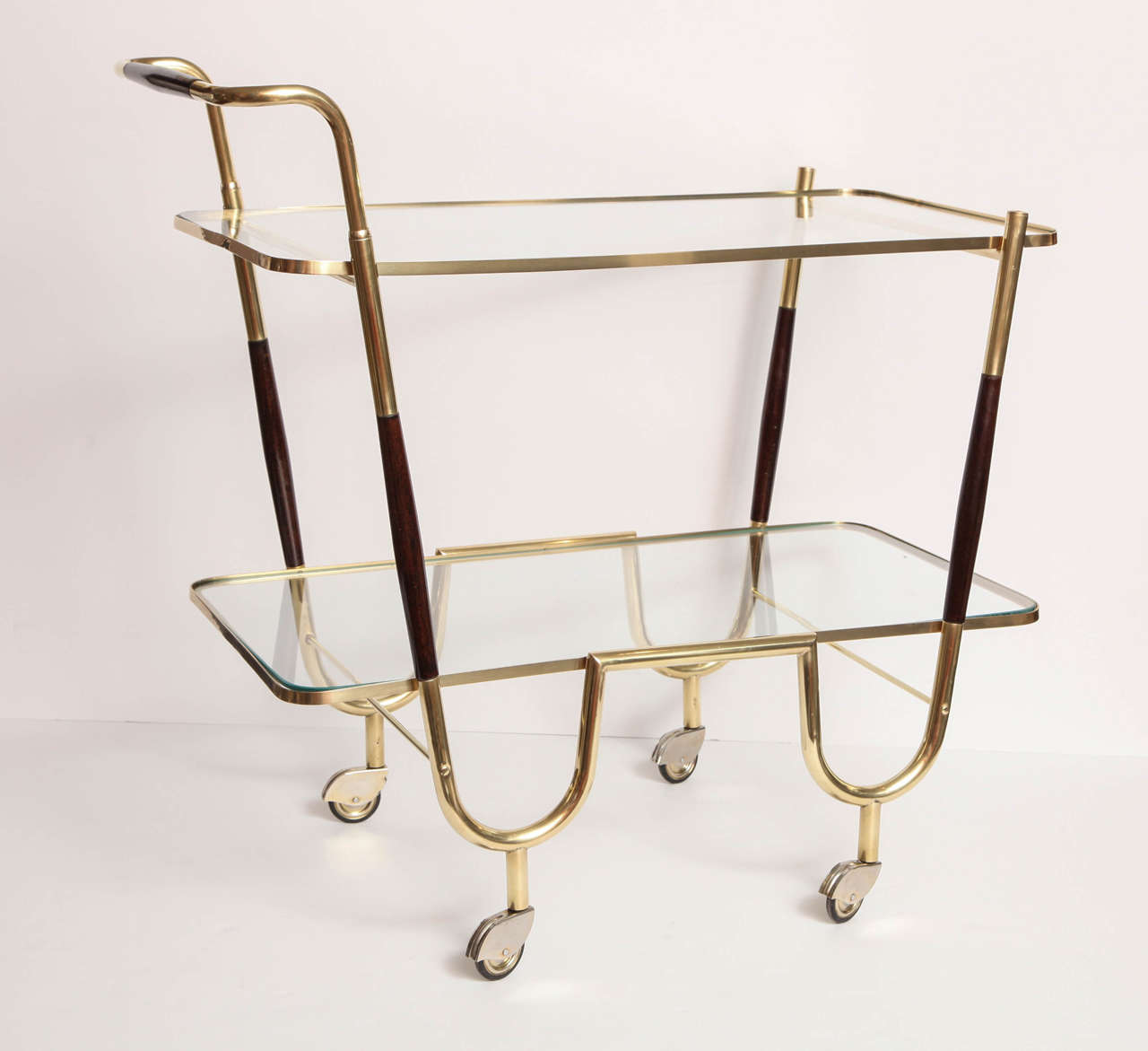 Decorative brass bar cart with mahogany details, Italy, circa 1950. The brass has been polished and is in a very good condition.