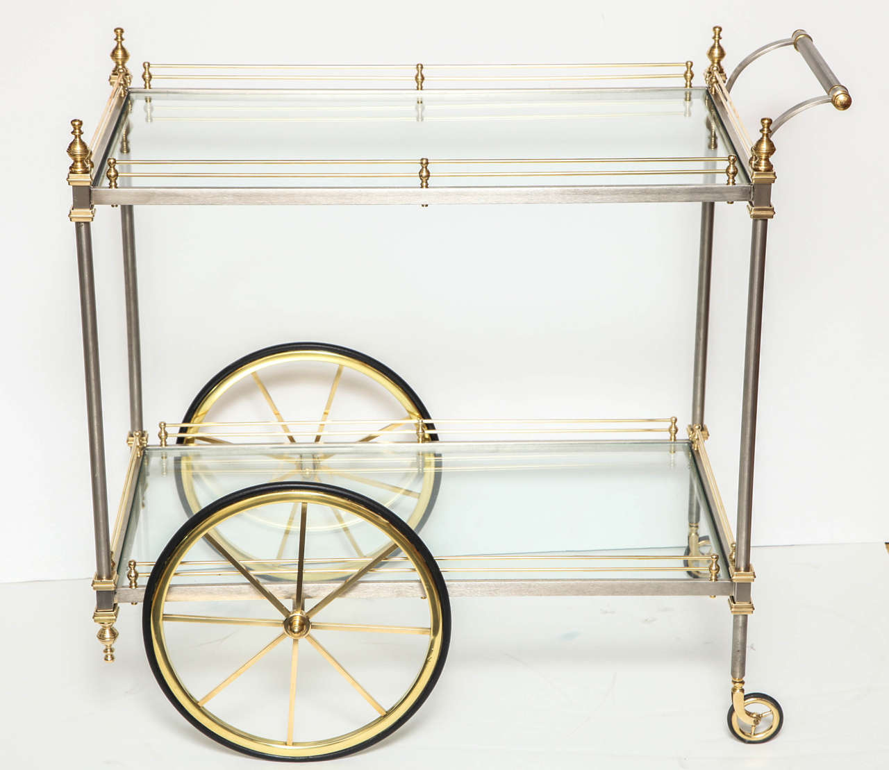Decorative large polished brass bar cart with brushed chrome details. Italy, circa 1960.