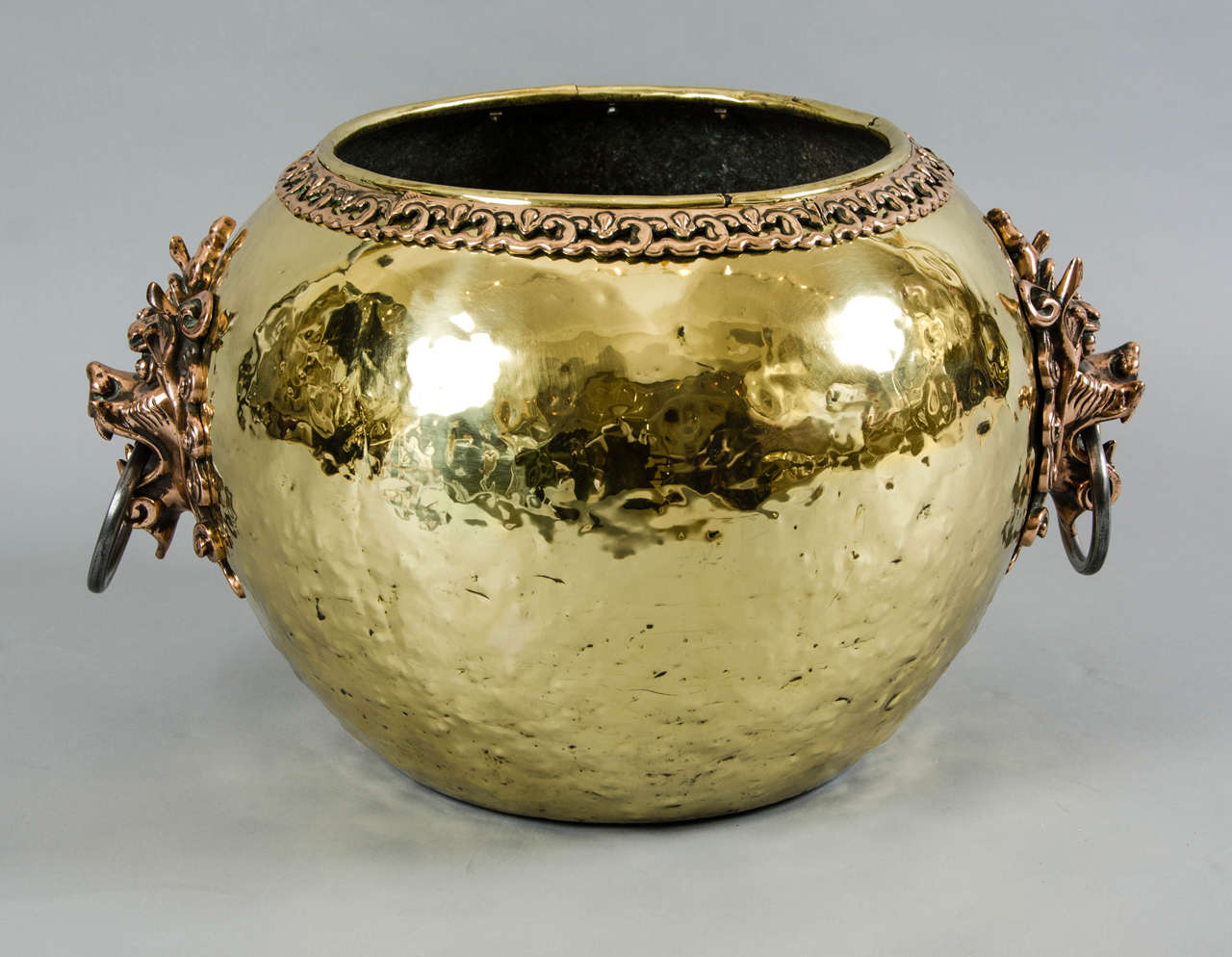 A large brass, Victorian jardiniere or wine cooler, with distinctive dragon handles.