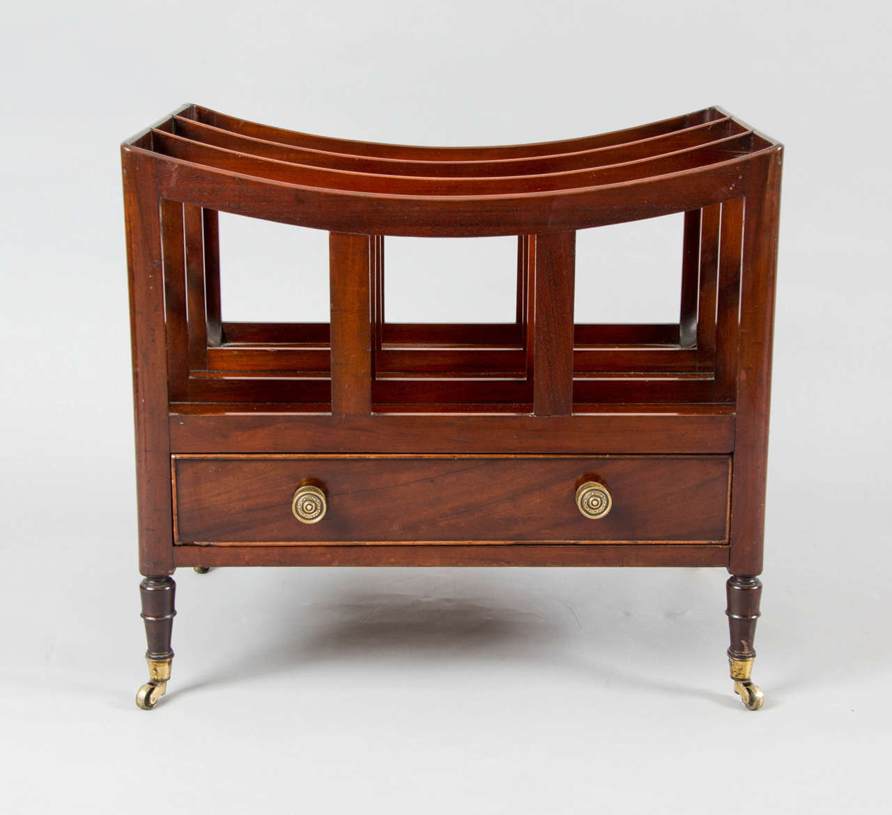 A good, late George III mahogany canterbury with replaced brass handles