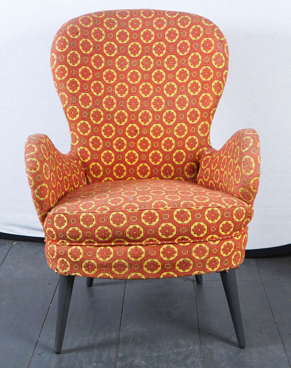 These boldly designed chairs have a uniquely graphic patterned fabric.
(The upholstery is original and would require some attention).
The Silhouette is wonderfully unique and the designer is unknown but relies heavily on the Italian designs of the