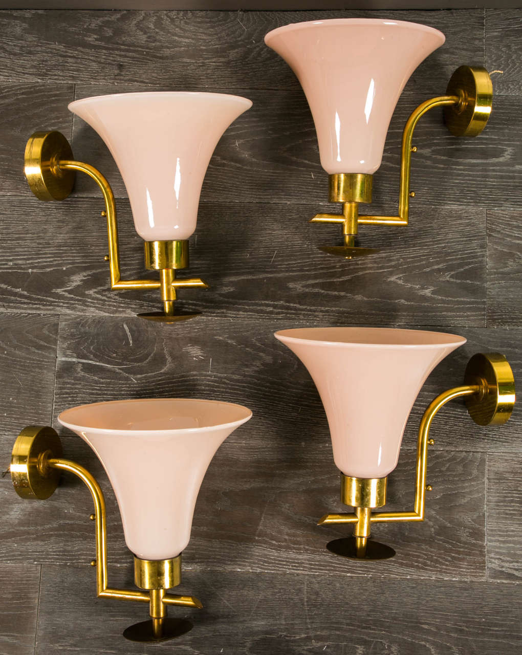 Elegant set of four sconces in brass with nice top in glass, pink white color, nice lighting,
circa 1960.
Please note that it's possible to have eight others sconces with the same design.
Provenance: French hotel in the 1960s.