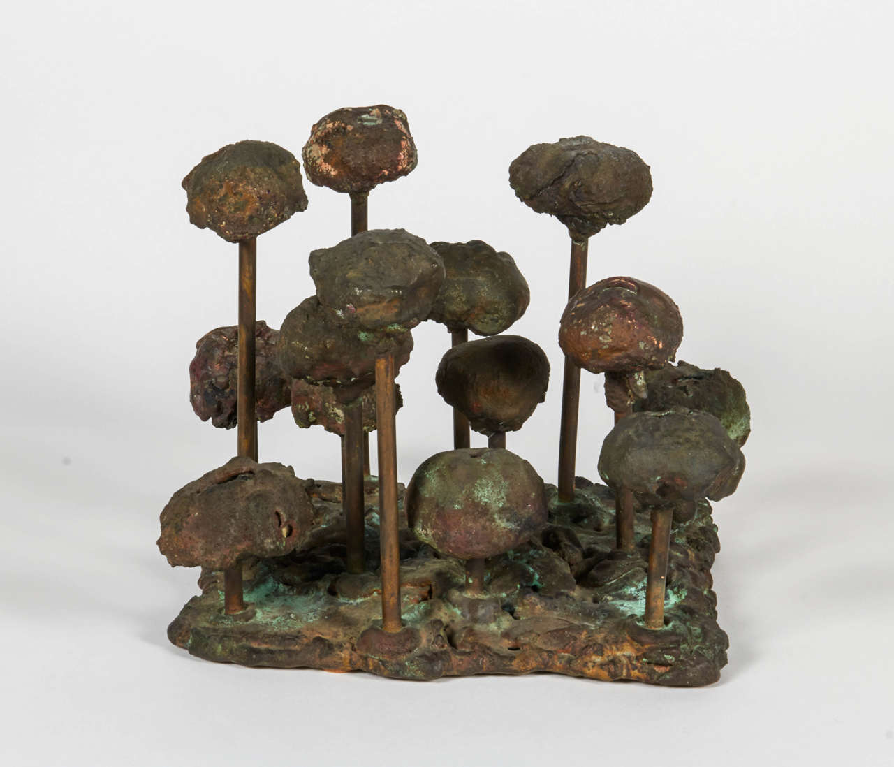 Bertoia's pressure melting or forging, technique had its roots in his earlier work in jewelry. Bertoia subjected the metal to heat and the hammer to mold it into the shapes he desired.