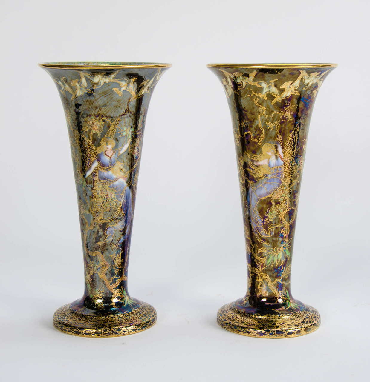 A rare pair of Wedgwood Fairyland Lustre vases.

The fairyland lustre design was created by Daisy Makeig-Jones. She started her career at Wedgwood in 1909. Between 1916 and 1941 she was chiefly responsible for the creation and Expansion of the