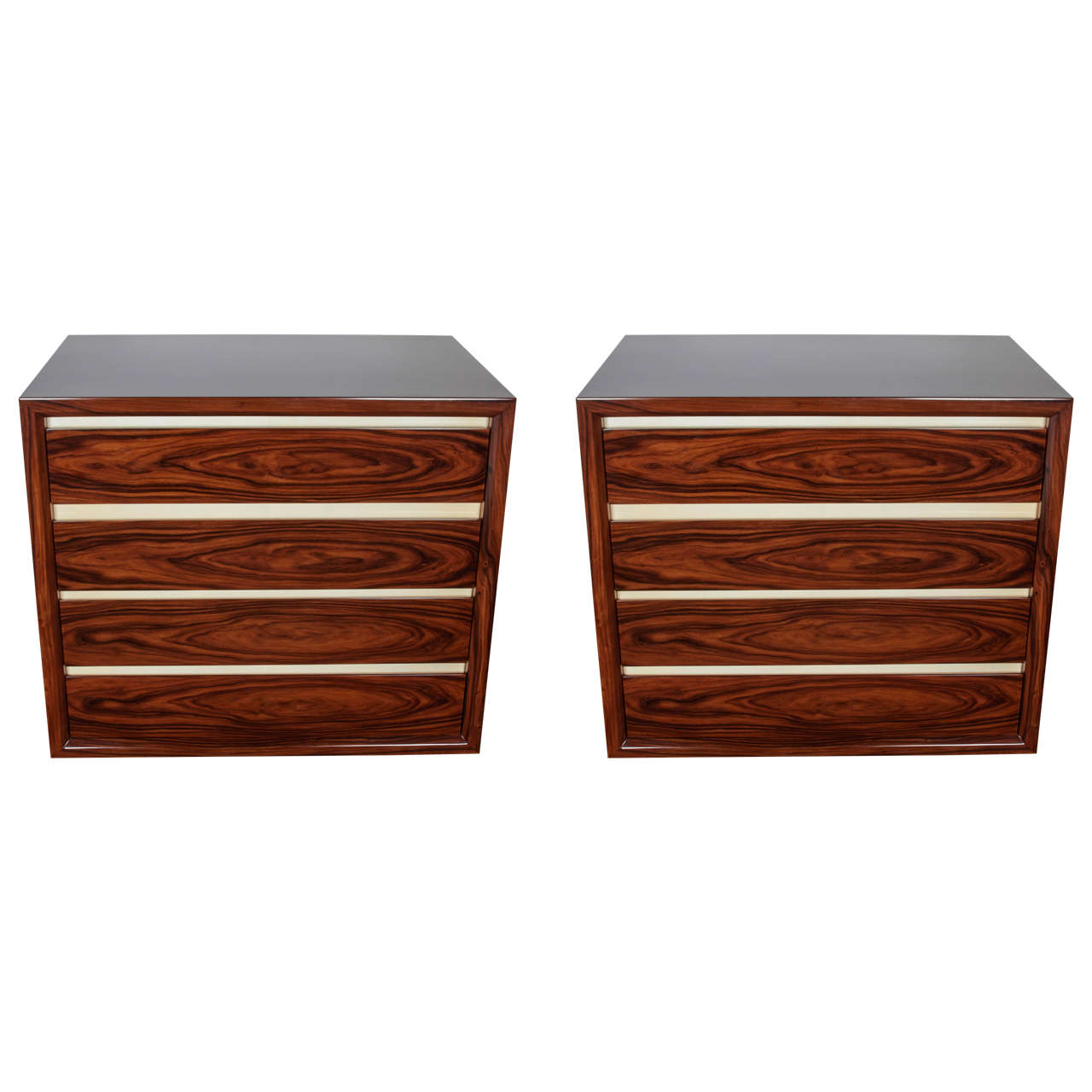 Exquisite pair of chests comprised of book matched rosewood with lacquered parchment (goatskin) trim. Each dresser is fitted with four drawers that feature a soft push-close. The commodes have streamline design and are handsome from all angles.