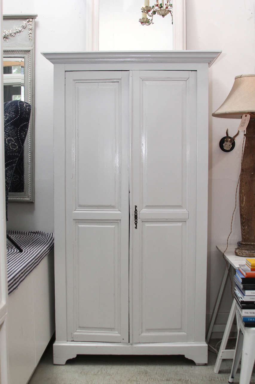 This armoire is very old but has been restored for full function. 
We have created a custom neutral color for this… it will be ideal anywhere.
Beautiful and very functional… would be fantastic in a bathroom filled with luscious towels and bedding.