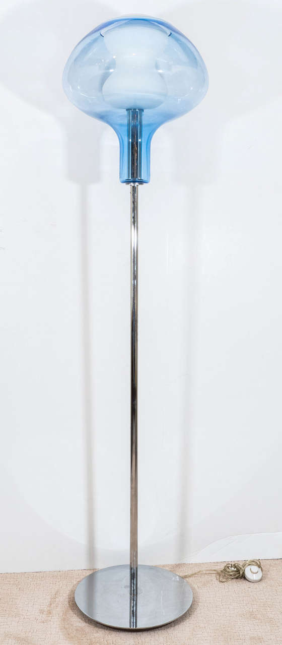 A vintage floor lamp, with handblown Murano glass shade, surrounding a Lattimo (Milk Glass) oblong interior, on a chrome stem and circular disk base. Wiring and socket to US standard, requires one Edison base bulb. Good vintage condition with some