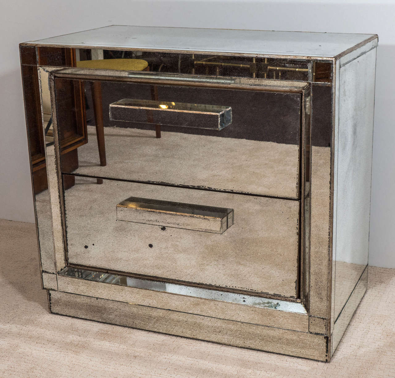 A Midcentury Pair of Antiqued Two-Drawer Mirrored Nightstands