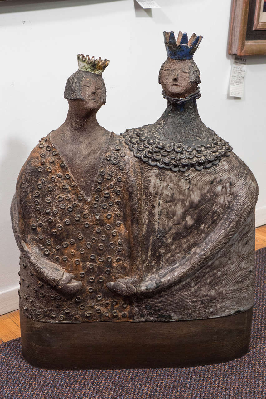 A vintage expressionistic sculpture of a Queen (left) and King (right), in mixed-media ceramic, bronze and enamel, by German-born Canadian artist Hanni Rothschild, produced circa 1960s. The figures, though canonically female and male, gendered roles