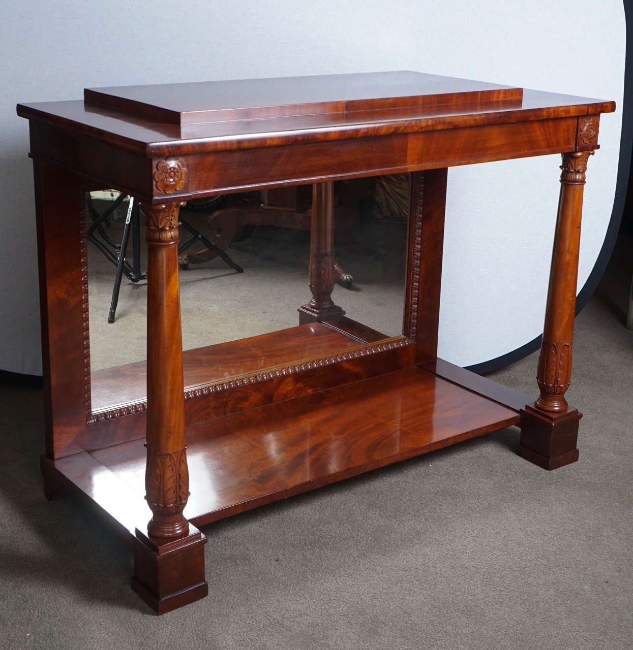 Neoclassical mahogany console with original mirror back.