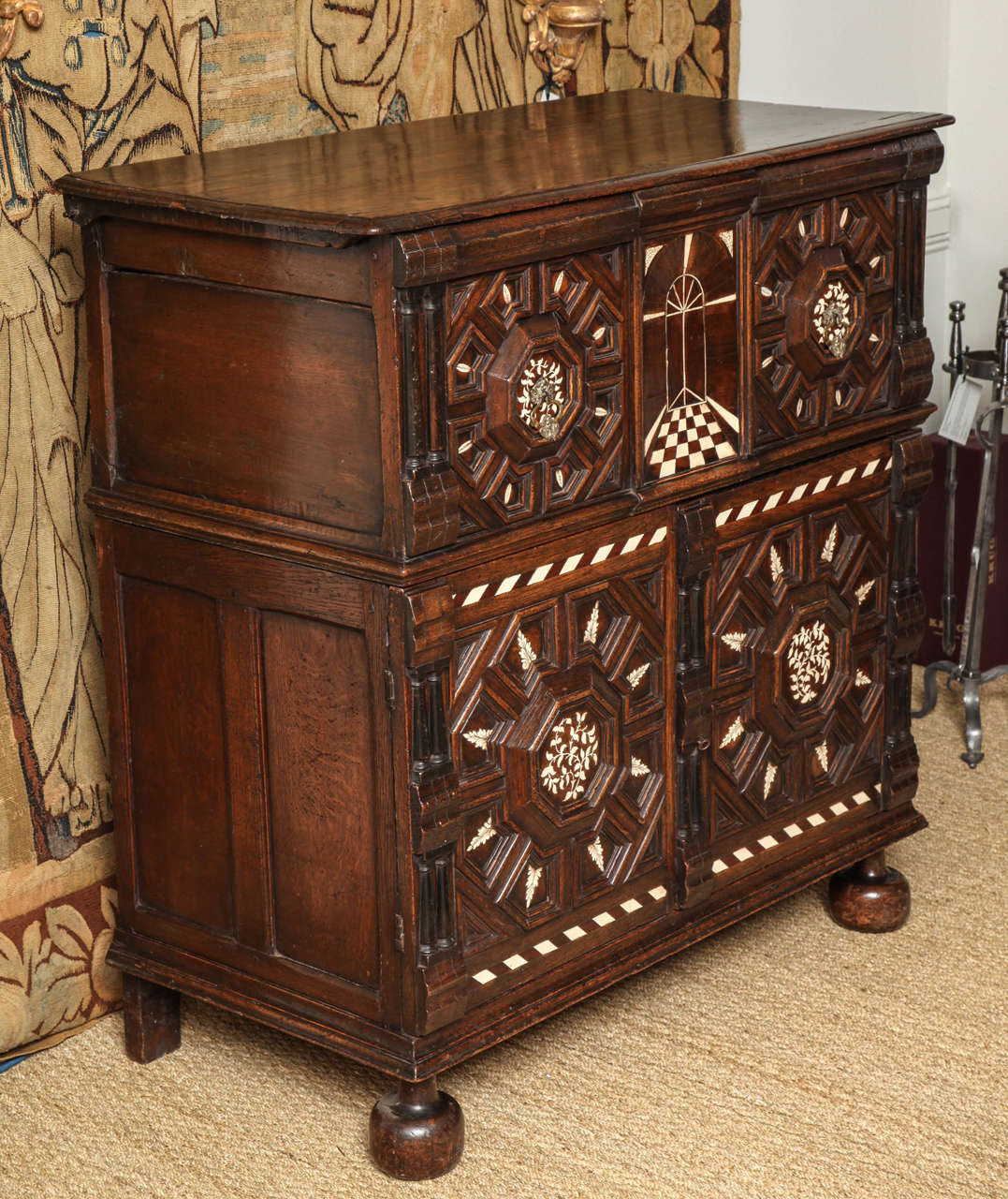 Rare Charles II period bone inlaid oak blanket chest on stand, the profusely geometrically molded and inlaid front with ebonized  split turnings, prospective center panel and richly decorated throughout in two parts, the upper section with peg
