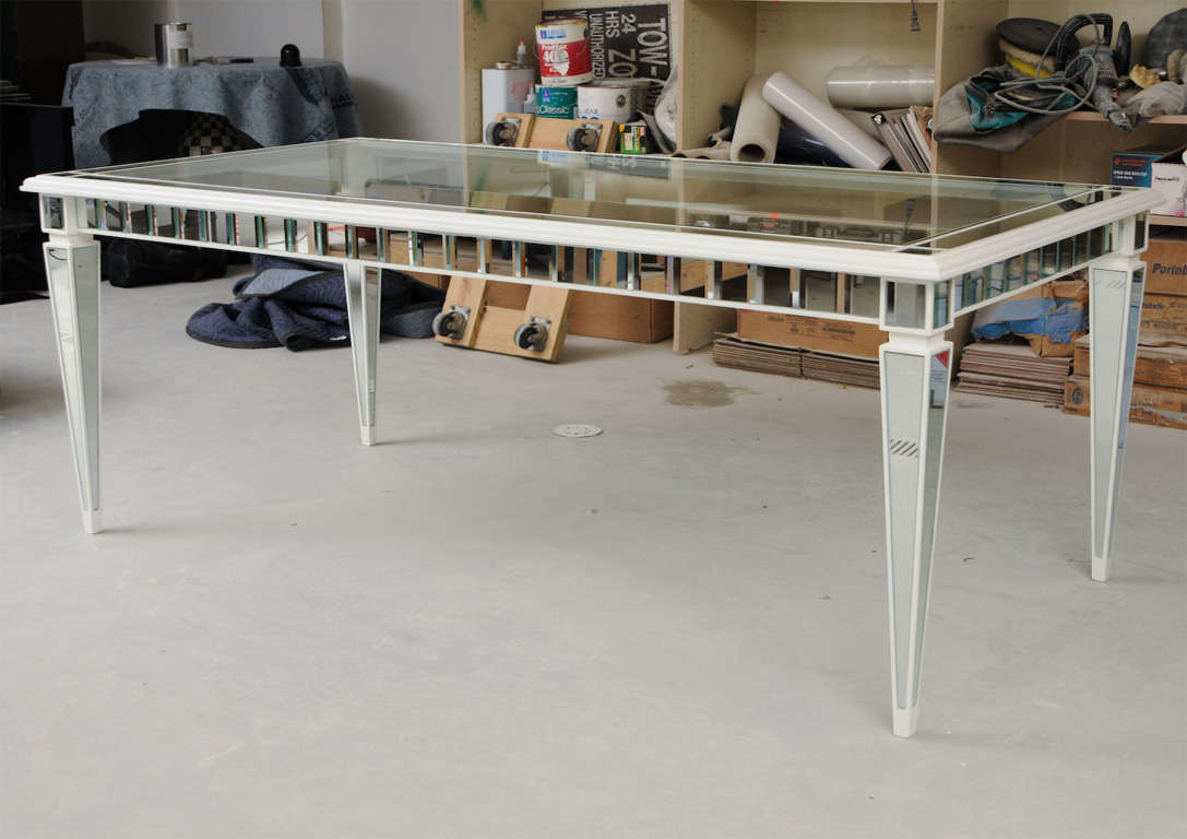 Custom glass and mirror table, wood, with high gloss lacquer finish, msr 40in. by.80 as shown 30 inches high, can order custom size and color!
Antique mirror or clear.