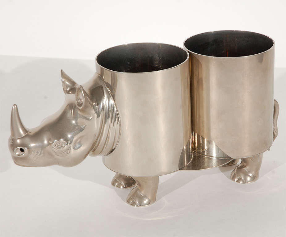 Wine bottle holder in shape of a rhinoceros in nickel plated brass.