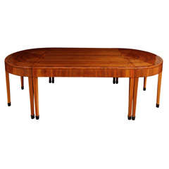 A rare Art Deco Walnut Dining Table by Heals.