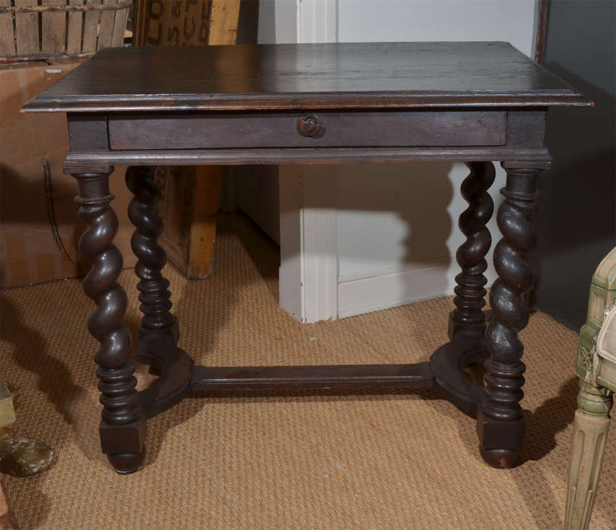 19th Century French Oak Writing Desk with beautiful barley twist legs.  This piece has a rustic & distressed patina. It is perfect for any room in your home.