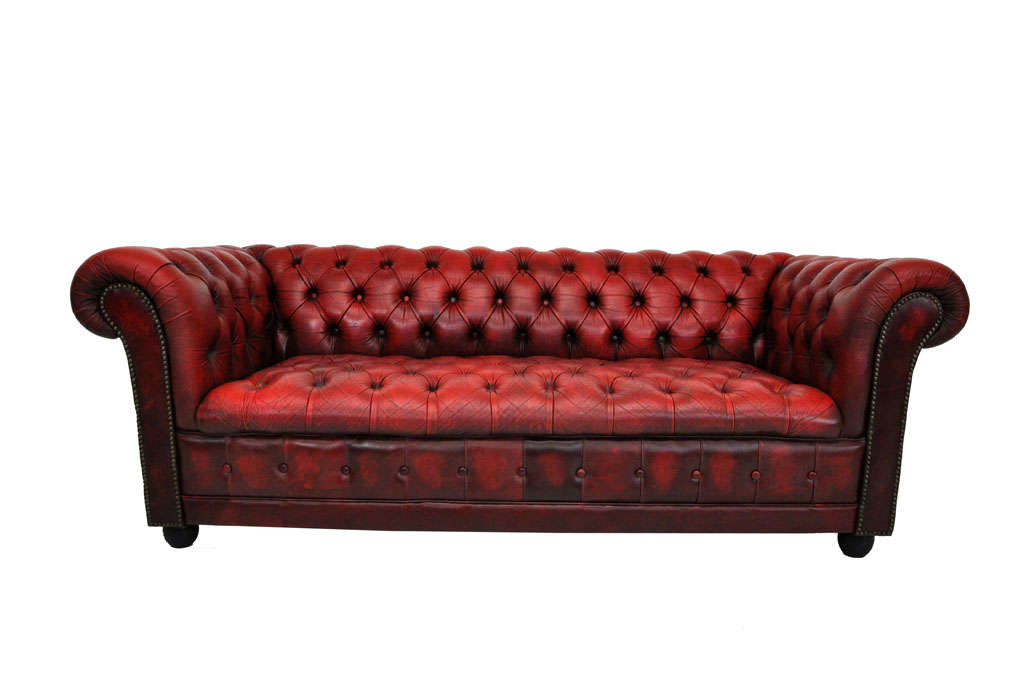 Ox blood red leather chesterfield sofa.  Beautiful worn in patina.  No cracks or tears to leather.