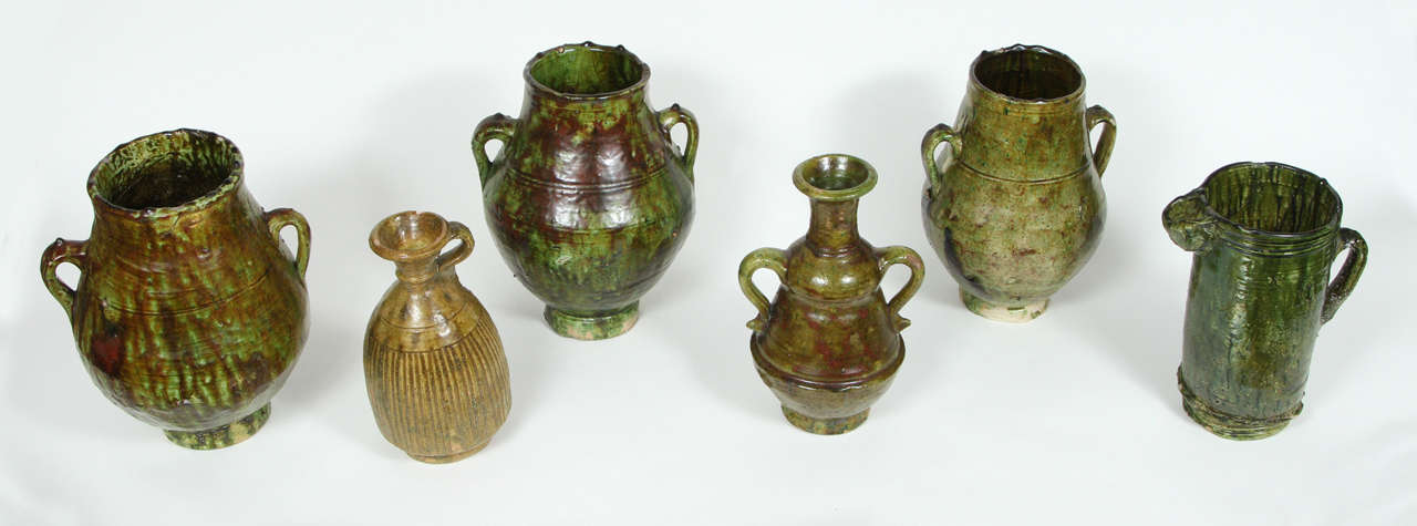 Moroccan Berber green glazed decorative terra cotta jars .
Wonderful green shimmering.
These vintage tribal handcrafted green jars were used to store olive oil, vinegar, butter, the larger ones were used for meat and fat.
Picture 3: Size is: