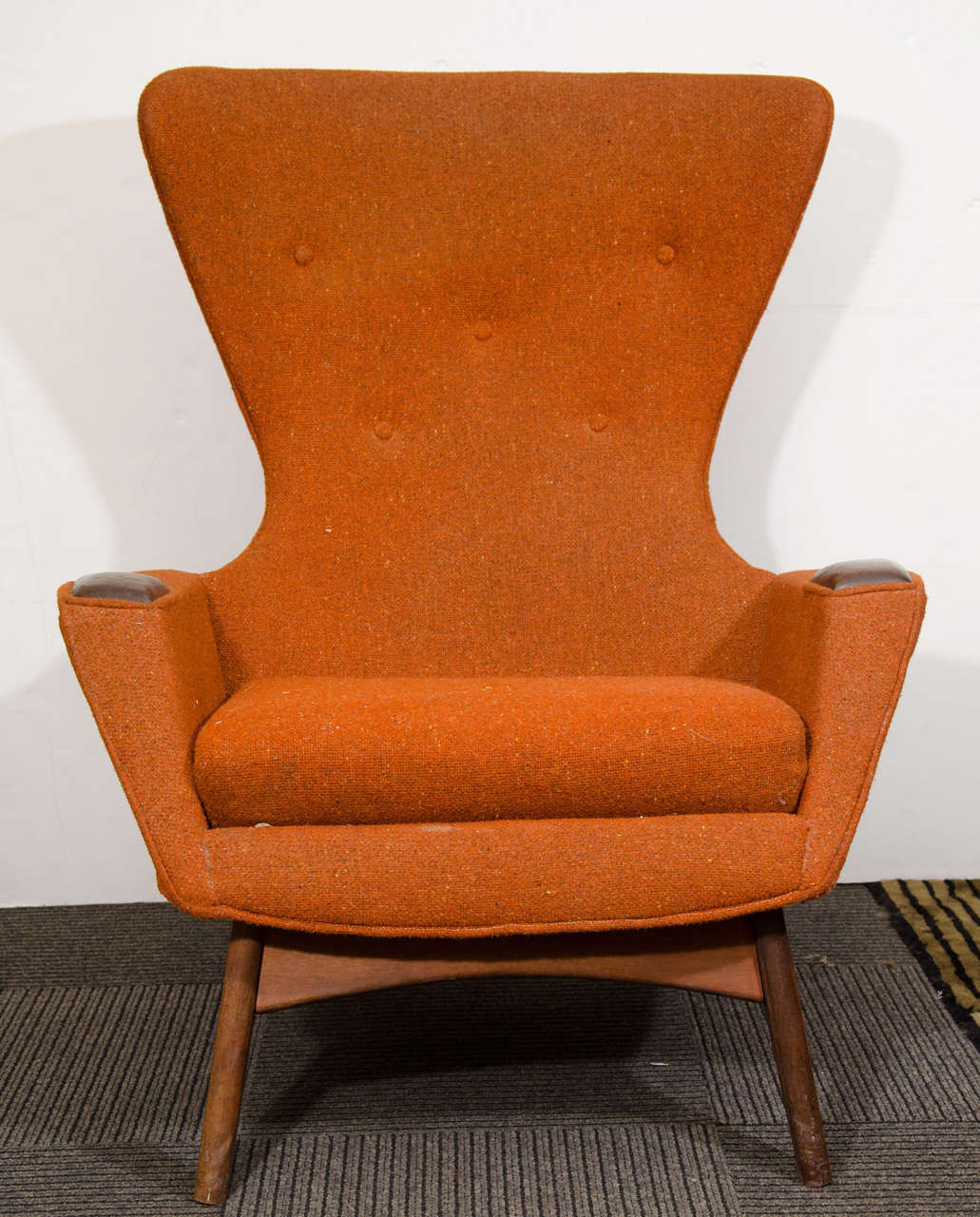 A vintage high back sculptural wing chair in original orange fabric by designer Adrian Pearsall.  

In good vintage condition with age appropriate wear.  Slight fading to upholstery.

Reduced from: $5,500