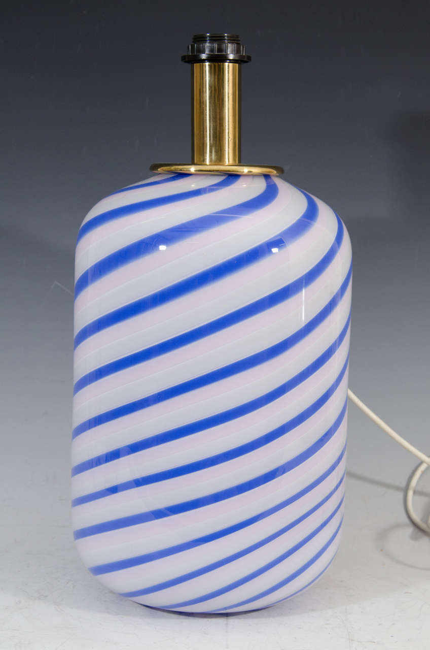 Fabulous pair of white, blue and pink striped table lamps by Casa Luce with glass bodies that illuminate Internally,as well as Regular Lamps. Both lamps retain their original labels that read, 