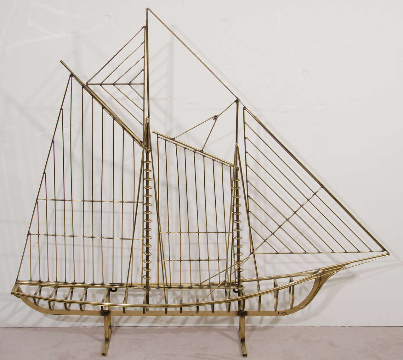 Bright Brass Metal Sailboat sculpture that can be used placed upon a Console and Mounted upon the Wall.Great Modern Nautical Design Signed C. Jere 1976.