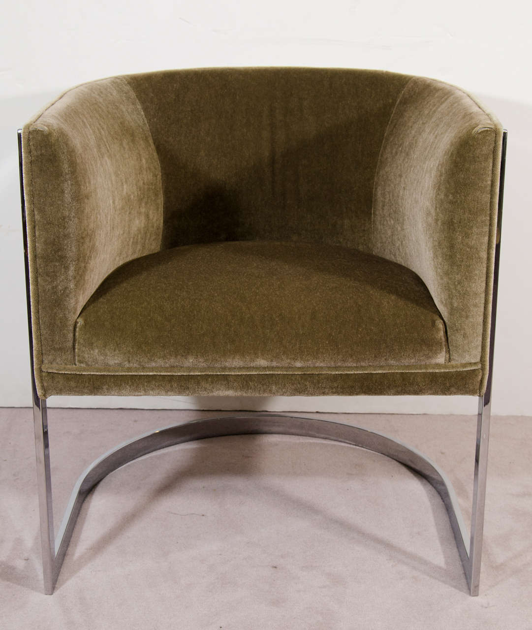 A vintage pair of tub chairs attributed to Milo Baughman with chrome frame, and newly upholstered in velvet.