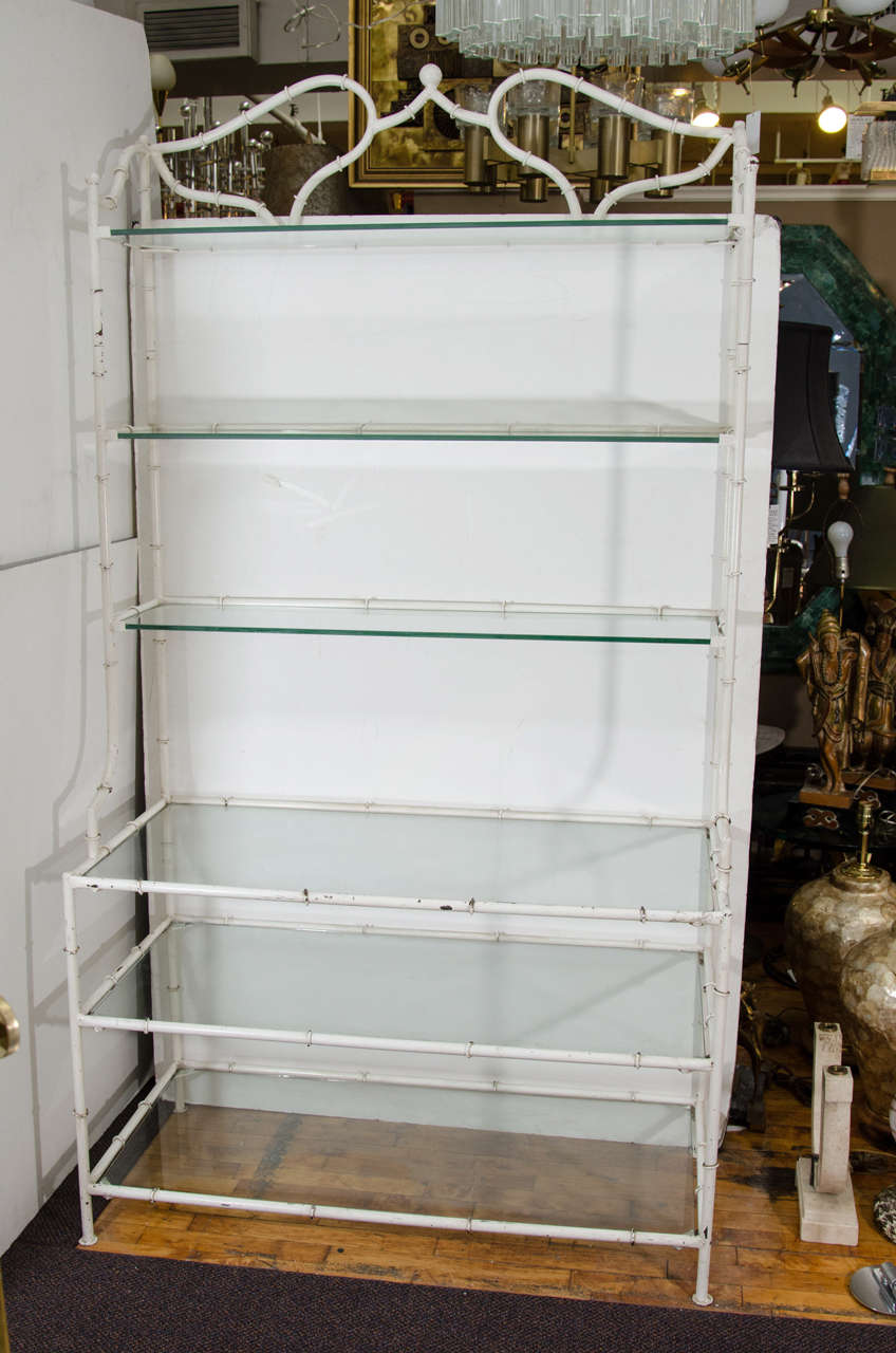 EA 1950s Hollywood Regency Italian Etagere with a White Enameled Metal bamboo frame and six thick original glass shelves.

 