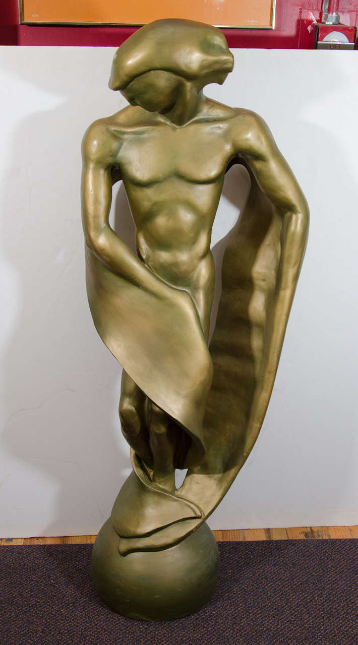 A vintage plaster statue of an abstract male figure painted with a bronze patina. Good vintage condition with minor wear to paint and nicks to plaster.