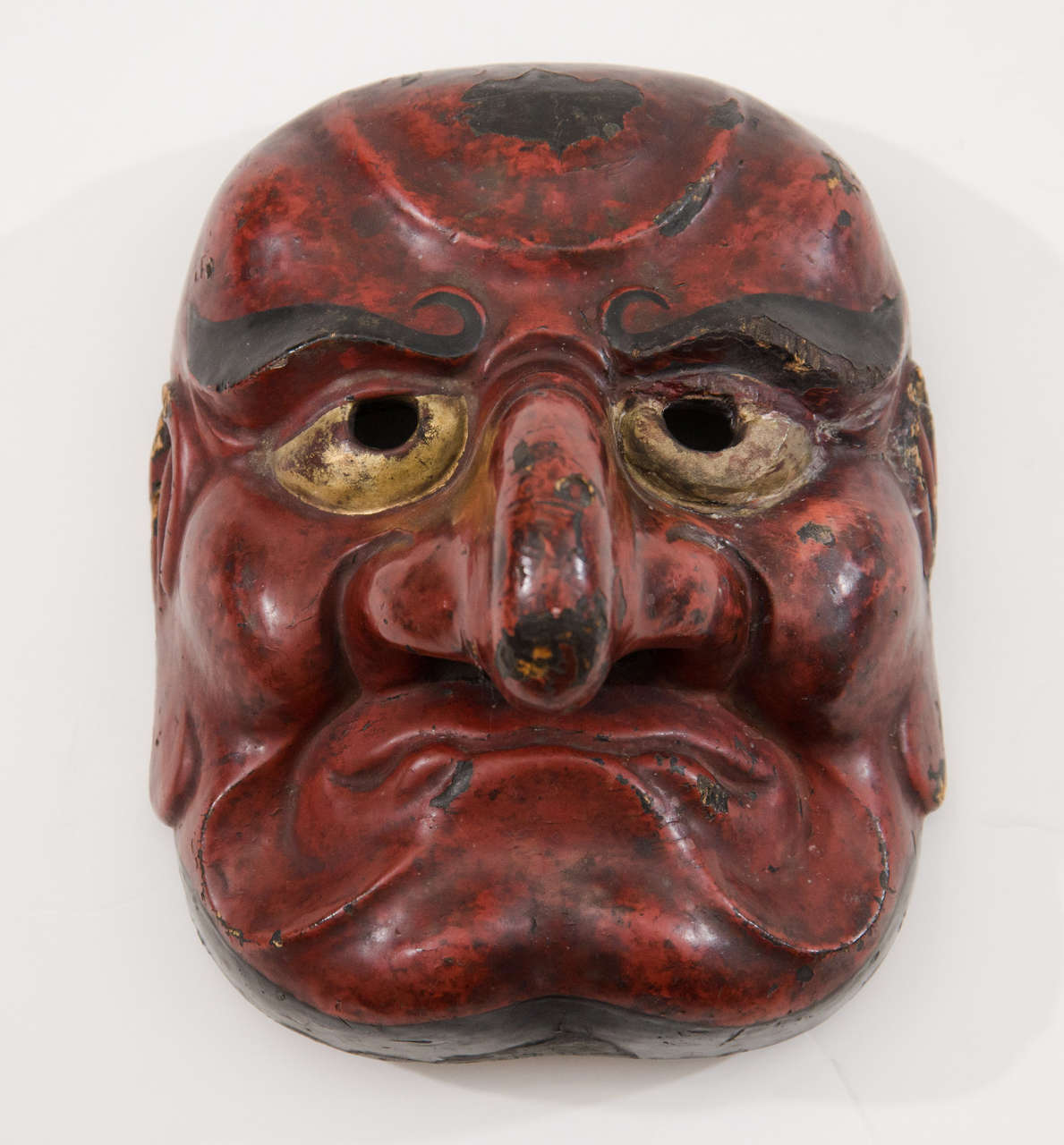 A rare Japanese comic demon Buaku Kyogen mask dating from the Edo Period, the golden age of Noh Drama.  The Buaku mask is a Kyogen version of the Noh Beshimi.  Kyogen were short, humorous skits performed between Noh acts to lighten the mood.  The