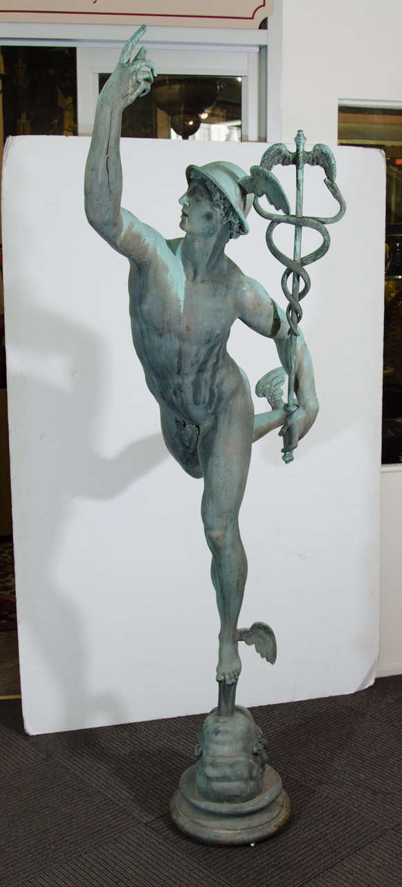A 19th century impressive Grand Tour bronze sculpture of Mercury after Italian sculptor Giambologna. The sculpture depicts Mercury wearing his winged helmet and sandals and holding a caduceus.  He is supported by the breath of Zeus.

Base: 13