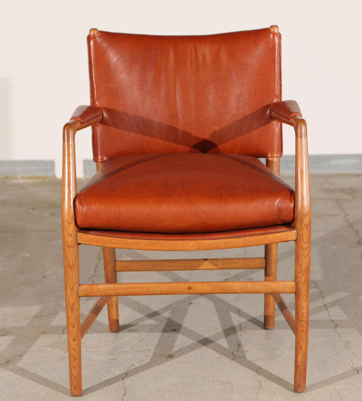 Pair of Hans Wegner leather upholstered armchairs designed for Aarhus Town Hall.