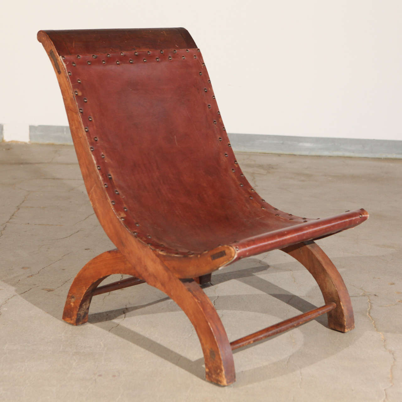 Pair of William Spratling leather upholstered chairs, Taxco, Mexico.