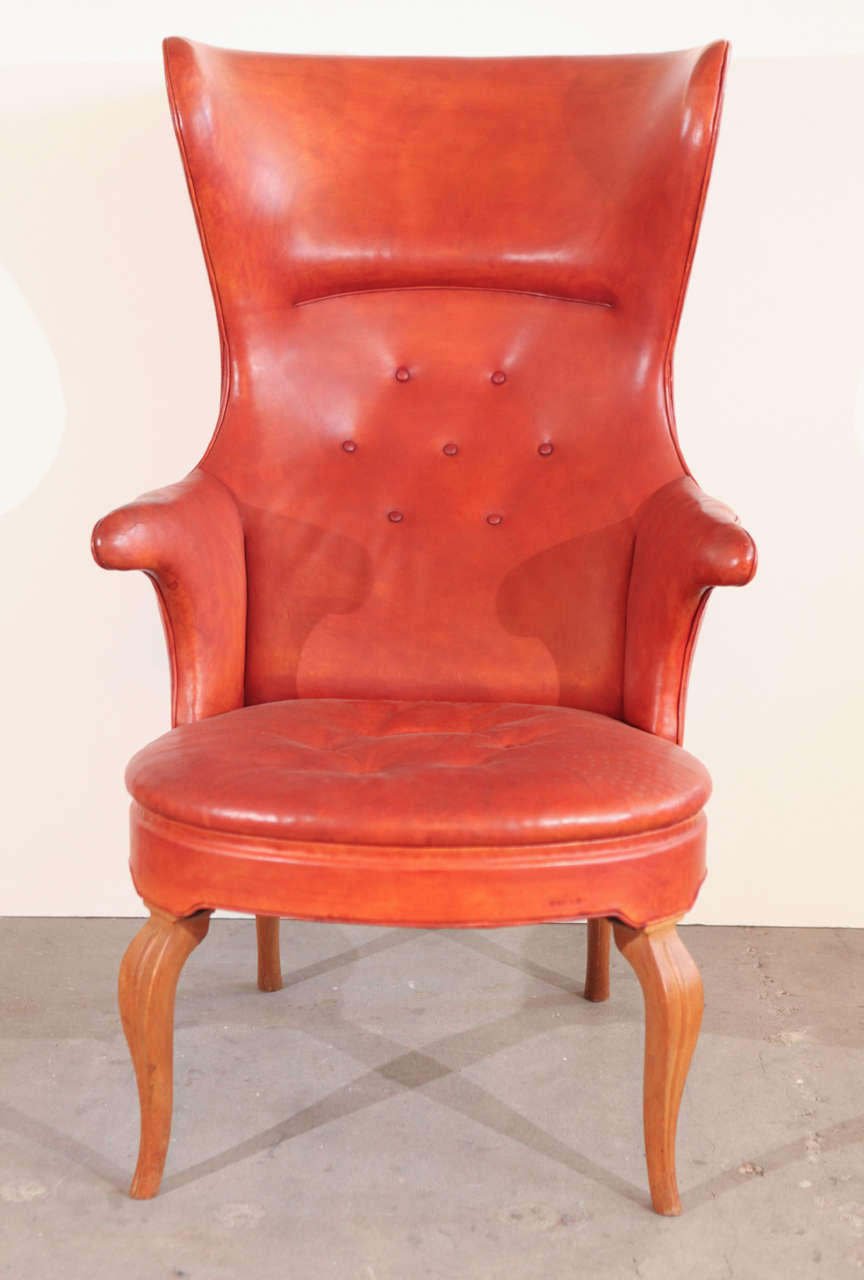 Frits Henningsen high back easy chair with oak legs and original reddish leather.  1939 Denmark