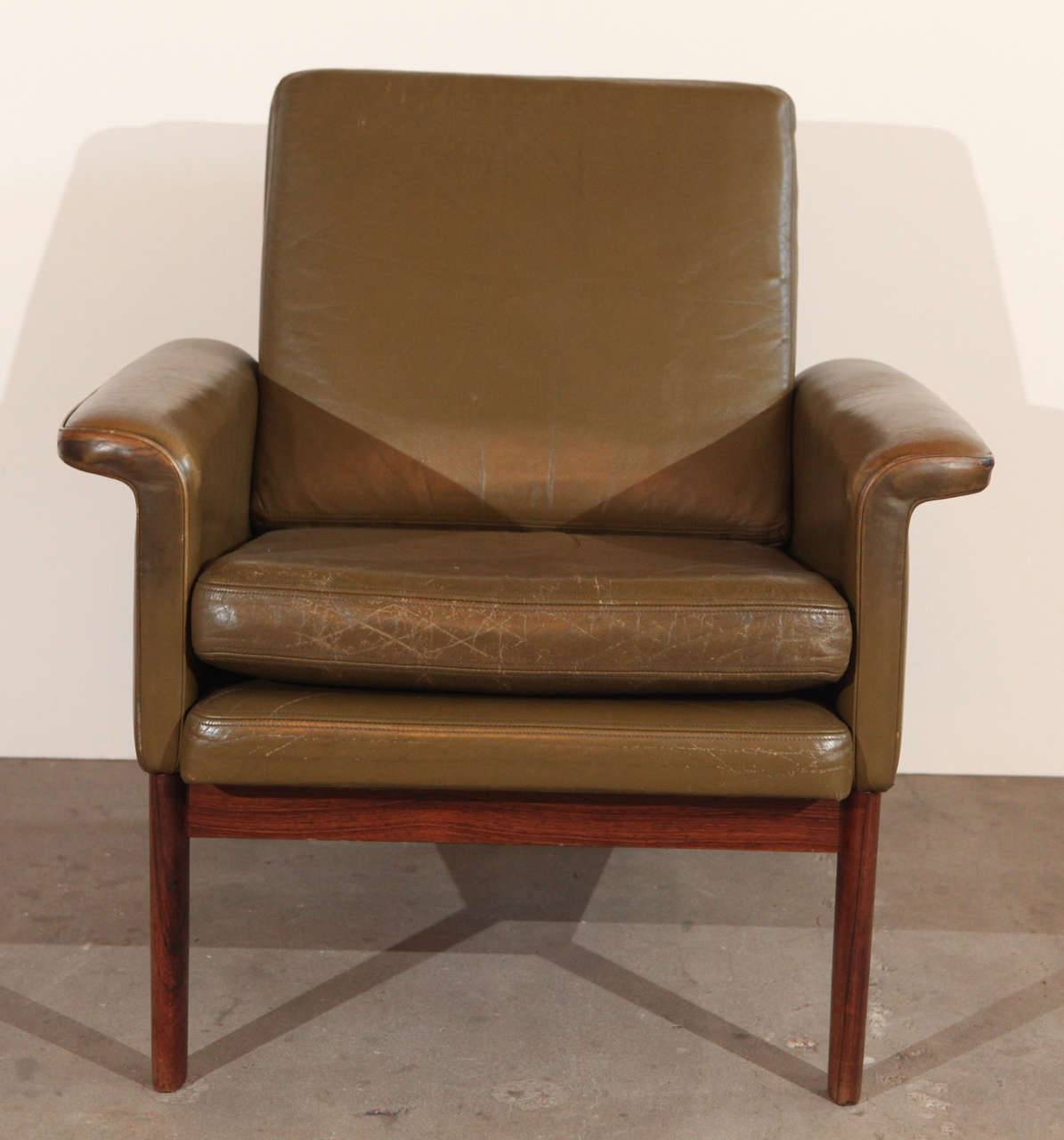 Pair of Finn Juhl armchairs in green leather. 1950's
