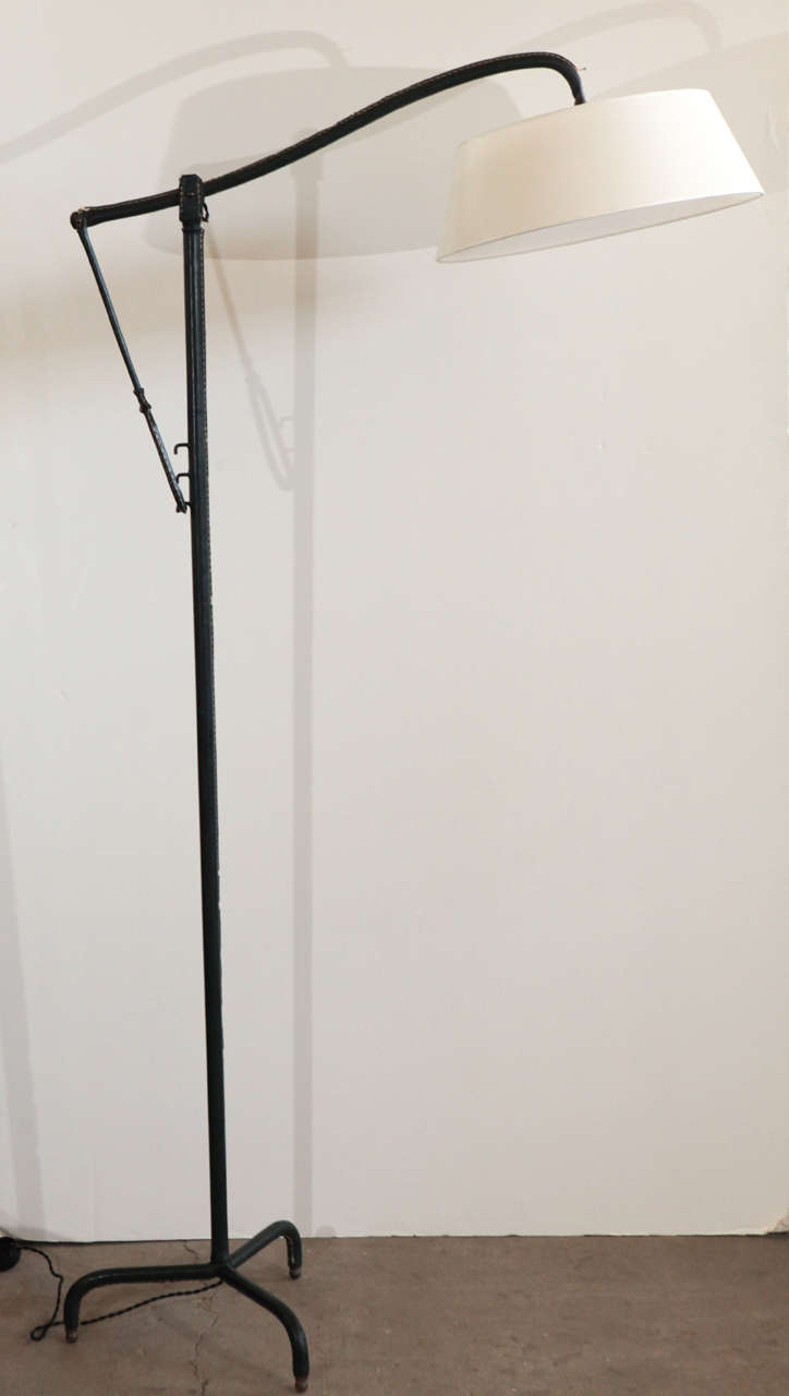 Adjustable leather floor lamp by Jacques Adnet