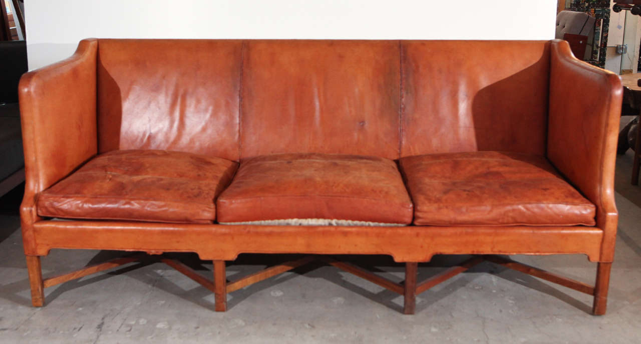 Denmark - Kaare Klint three-seat sofa in caramel leather, rare, 1940s.