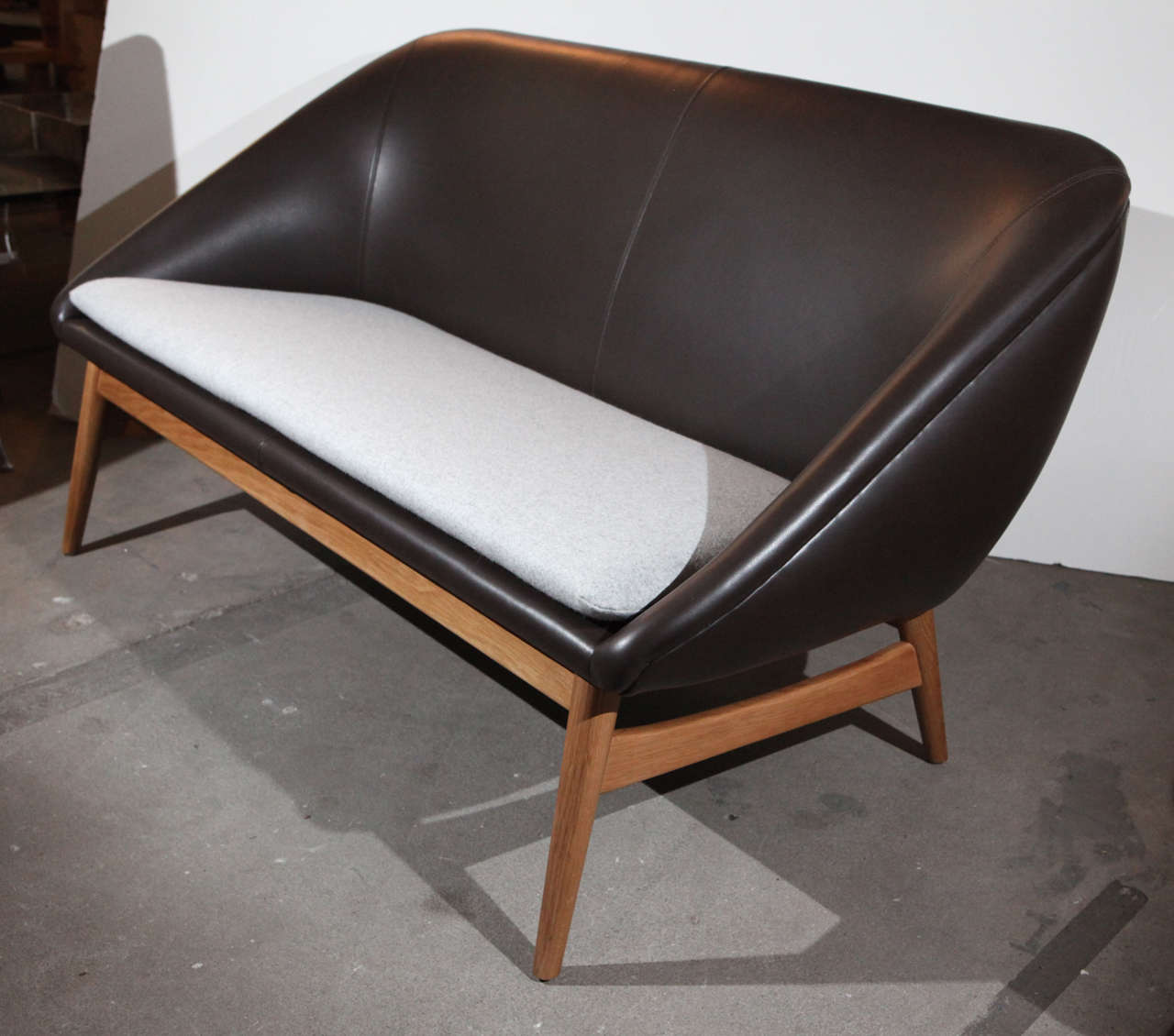 Sushi 2-Seater designed by Arne Hovmand Olsen In white oak, fabric and leather.