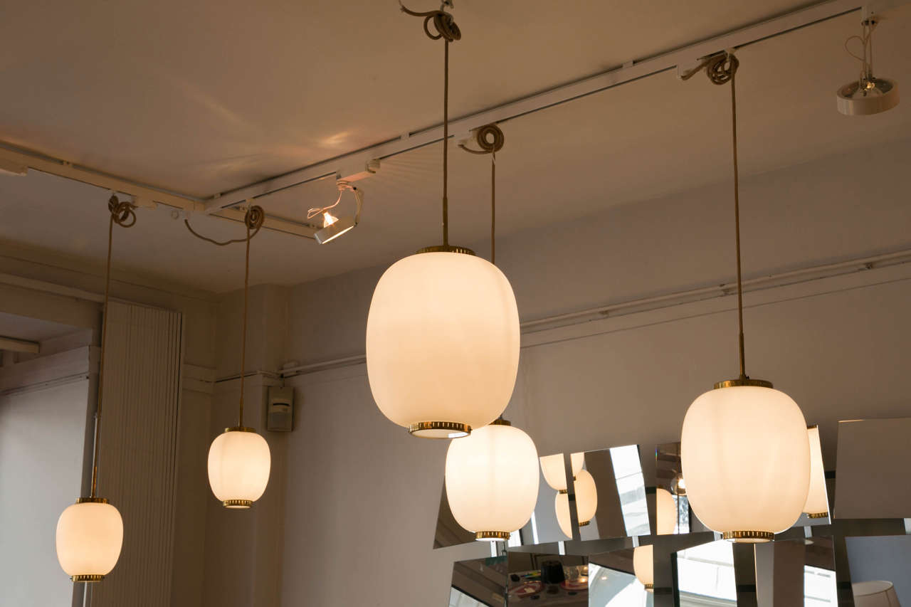 A set of five Opaline glass brass mounted ceiling fixtures by Bent Karlby for Lyfa.

Dimensions : 
- 2 ceiling fixtures HEIGHT 9,45 in  – DIAMETER : 7,09 in.
- 1 ceiling fixture HEIGHT 11,81 in.  – DIAMETER : 9,45 in.
- 1 ceiling fixture HEIGHT